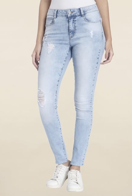 light colored distressed jeans