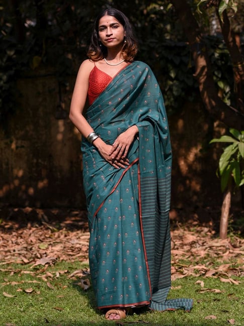 Lite teal blue silk saree in silver stripes, contrast double korvai border  & pallu intricately designed in silver zari