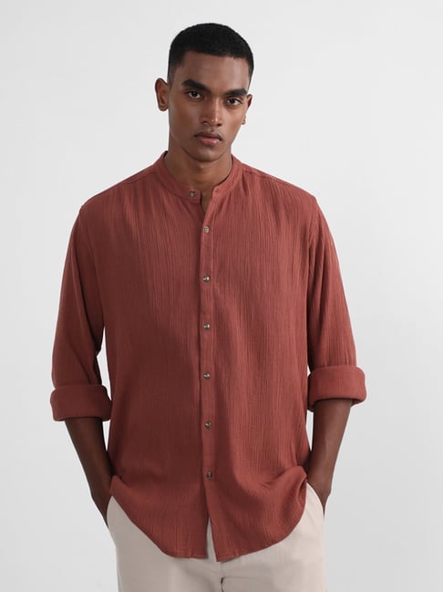 rust colored long sleeve shirt