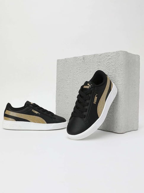 Black and fashion gold pumas