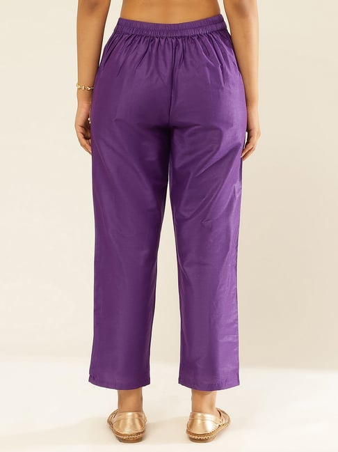 Premium Photo | Purple satin women's pajama pants on a white background
