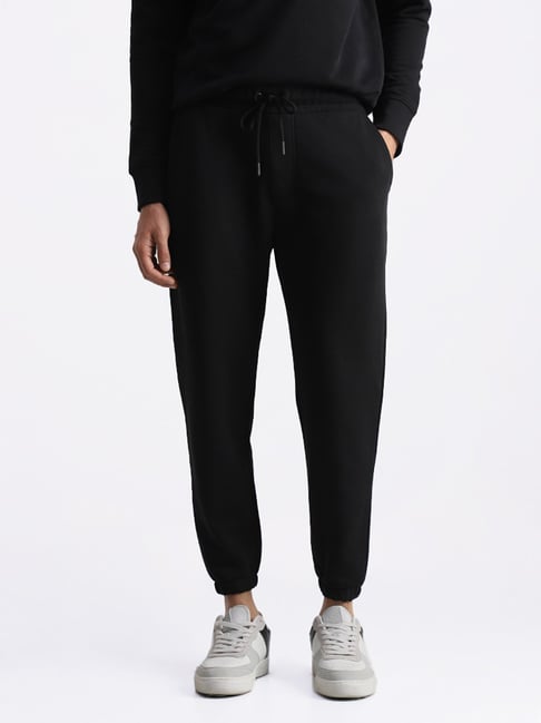 Buy WES Casuals by Westside Solid Black Relaxed Fit Trackpants for ...