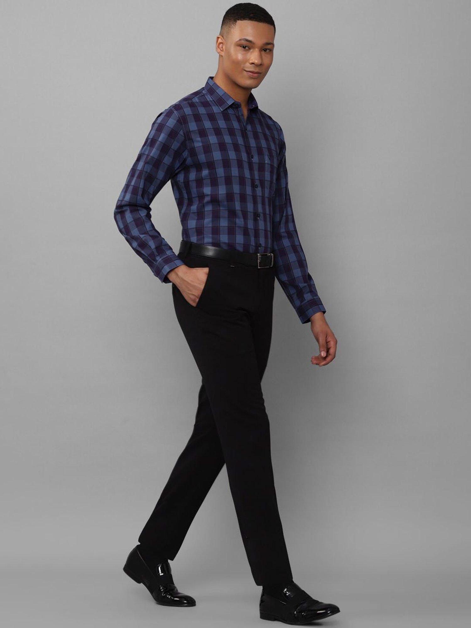 blue check shirt with black pants