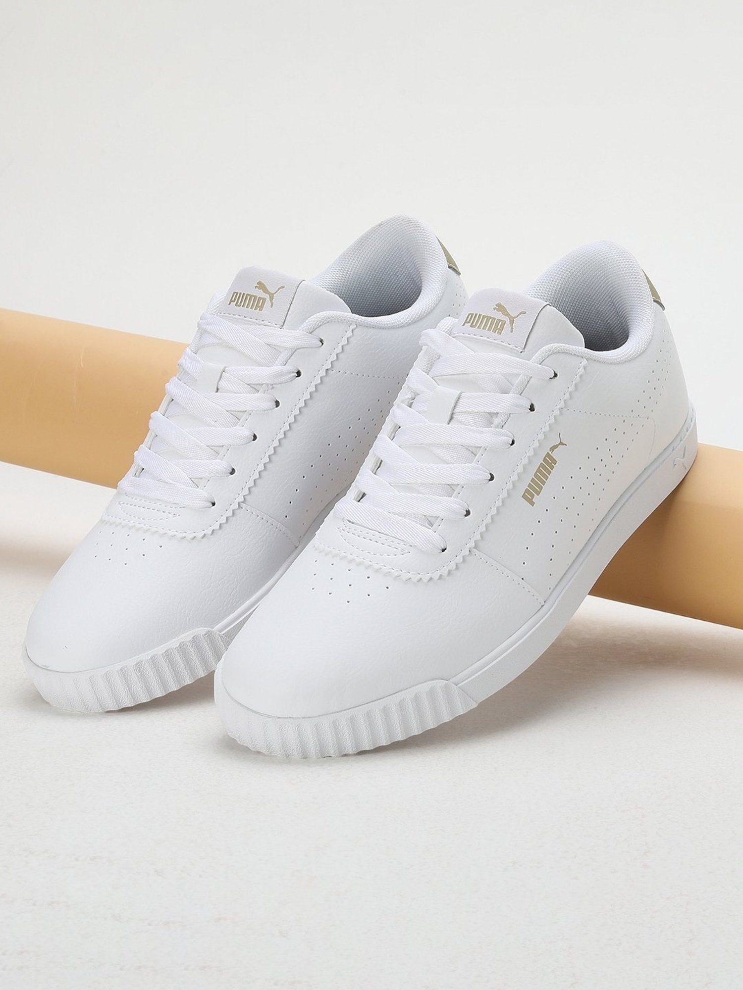 Buy Puma Women s Carina Slim Perf White Sneakers for Women at Best Price Tata CLiQ