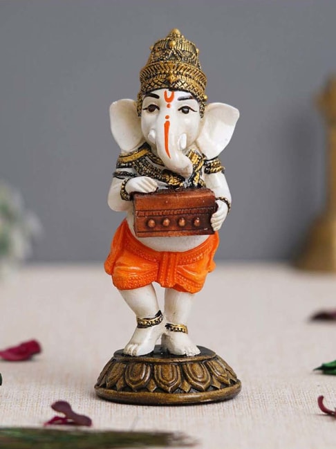 eCraftIndia White &amp; Orange Resin Lord Ganesha Idol Playing Harmonium Showpiece