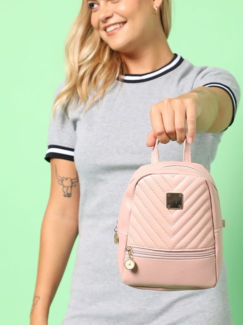 Pink best sale quilted backpack