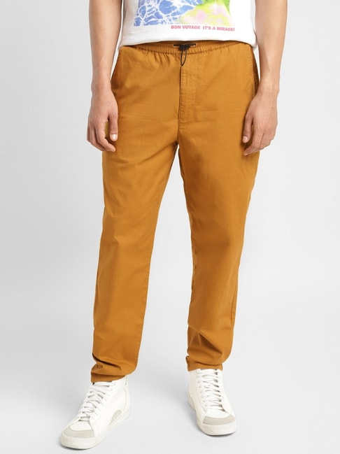 Buy INTUNE Khaki Solid Cotton Relaxed Fit Men's Trousers | Shoppers Stop