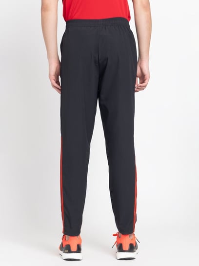 Adidas superstar cuffed on sale track pants black