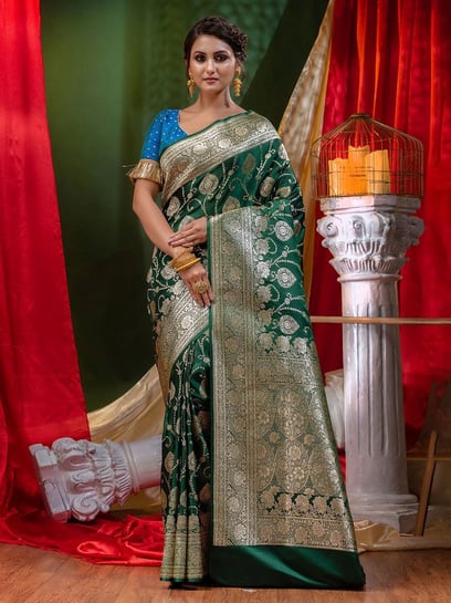 Bottle green color handloom raw silk saree with woven design