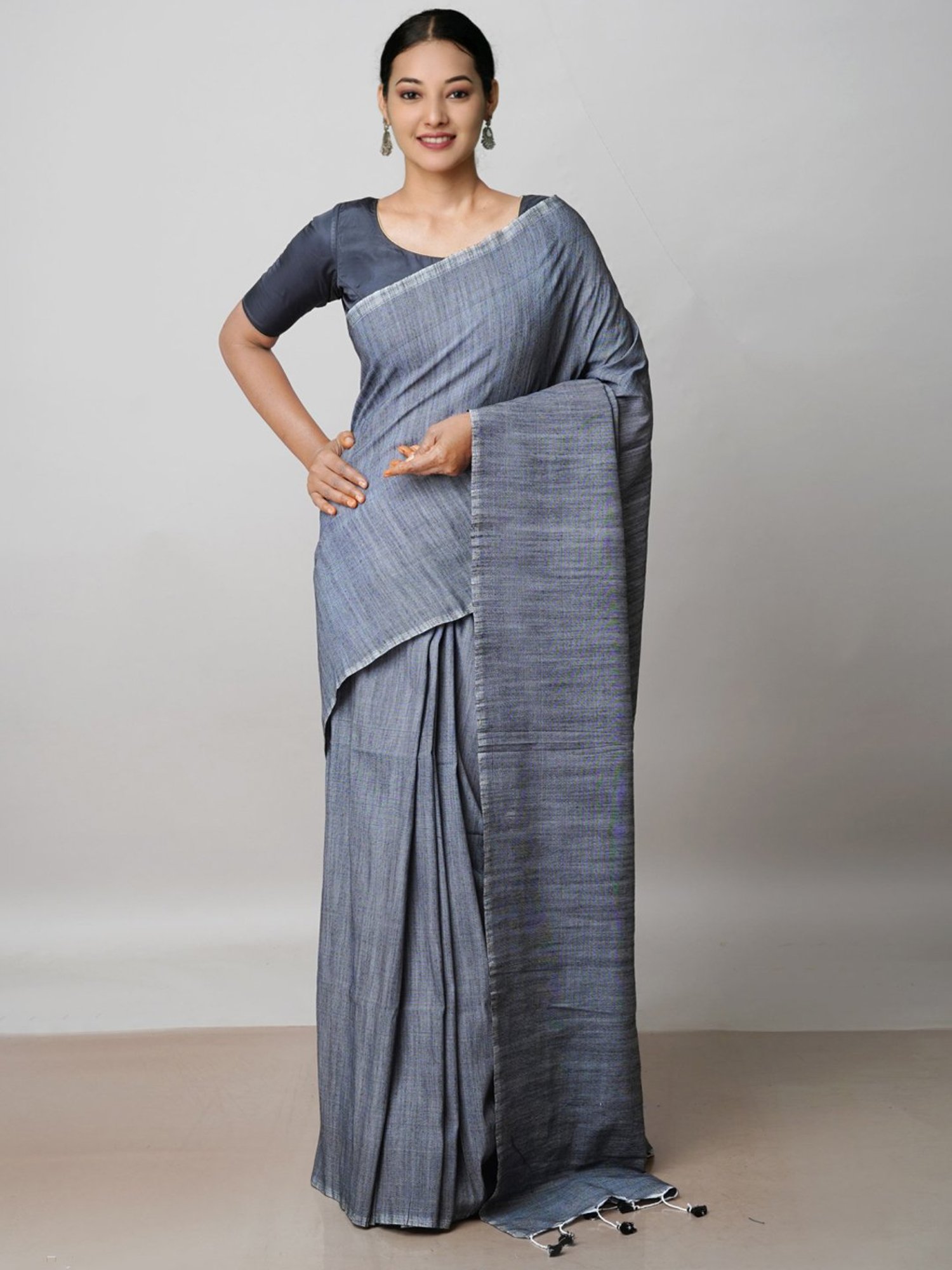 Grey linen saree with unqiue buttas on its body, zari border & pallu  accentuated with intricate designs