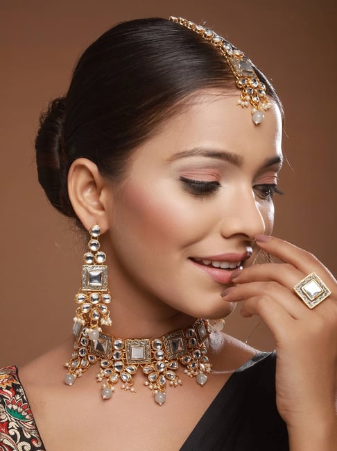 Aatmana Golden Kundan Studded Necklace, Earring, Maang Tikka Ring Set