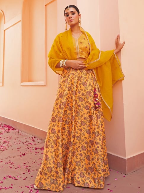 Photo of Yellow floral print lehenga with metallic blouse