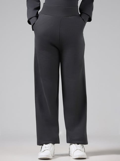 Buy Studiofit Solid Black Wide Leg Track Pants from Westside