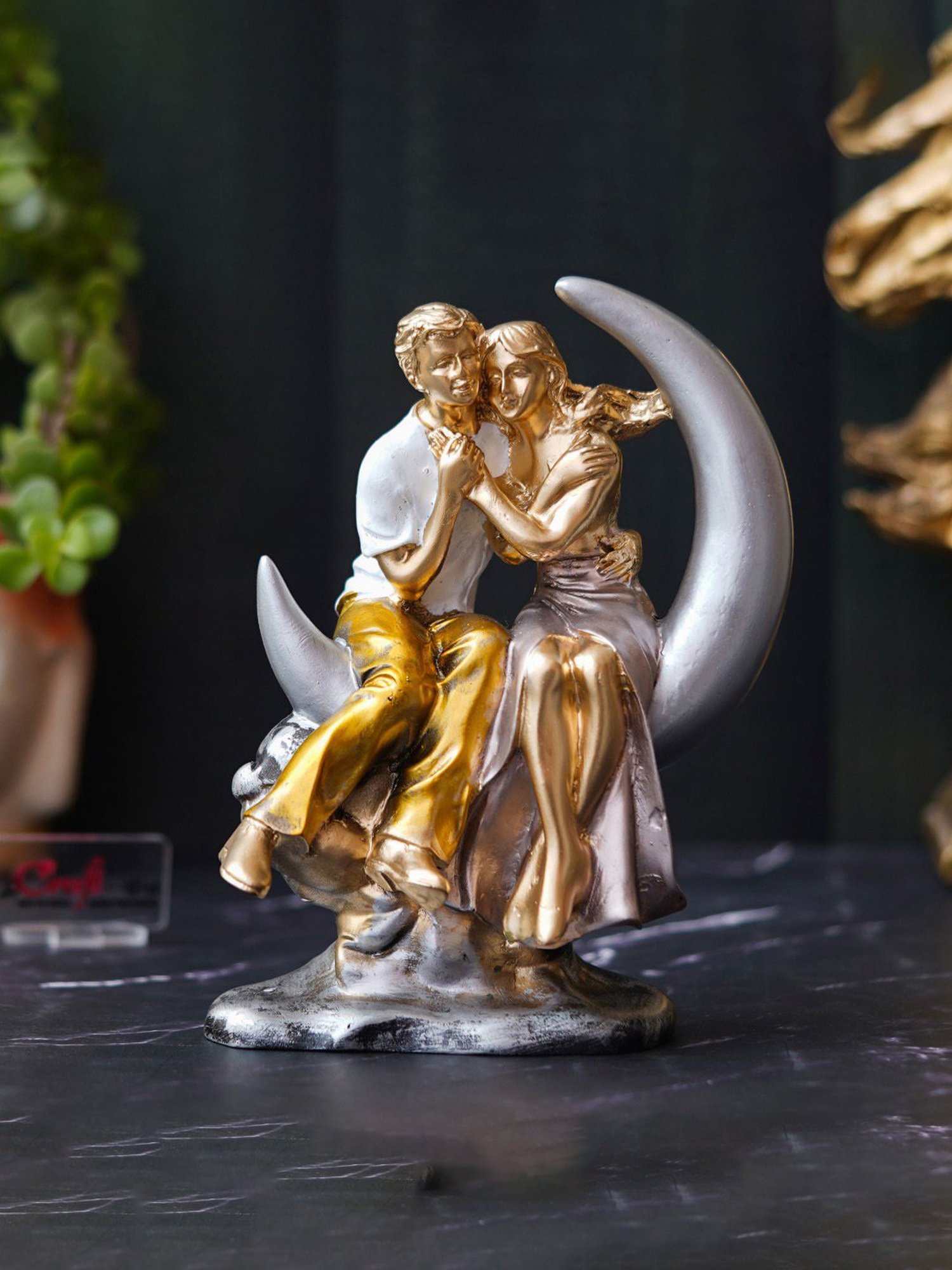 Buy eCraftIndia Polyresin Romantic Couple Statue Sitting on Moon Human at Best Price @ Tata CLiQ Buy eCraftIndia Polyresin Romantic Couple Statue Sitting on Moon Human at Best Price @ Tata CLiQ