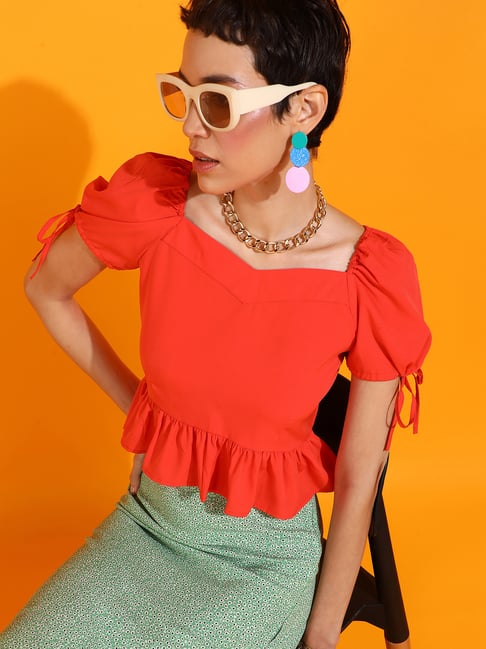orange peplum top