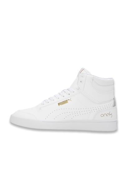 gold and white high top pumas
