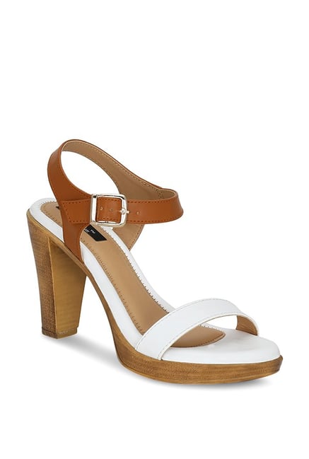 white and tan sandals