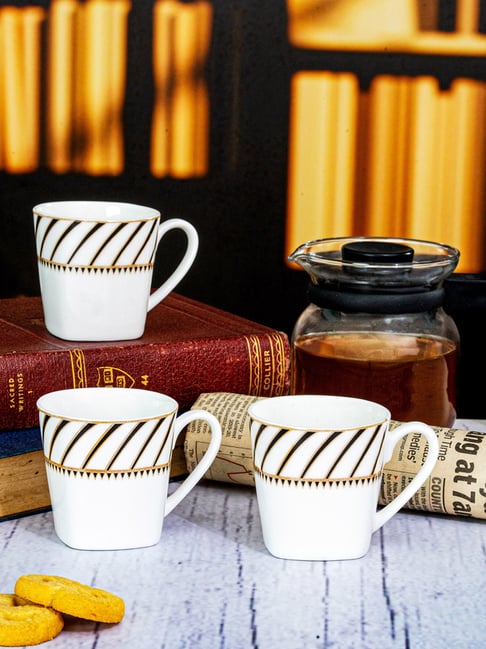 Price History of NFI essentials Set of 4 Ceramic Tea Cups with Stand Safe  for The Microwave and Dishwasher Stackable Tea Cup Printed Coffee Mugs for  Gifting with Holde from Amazon 63_79040670