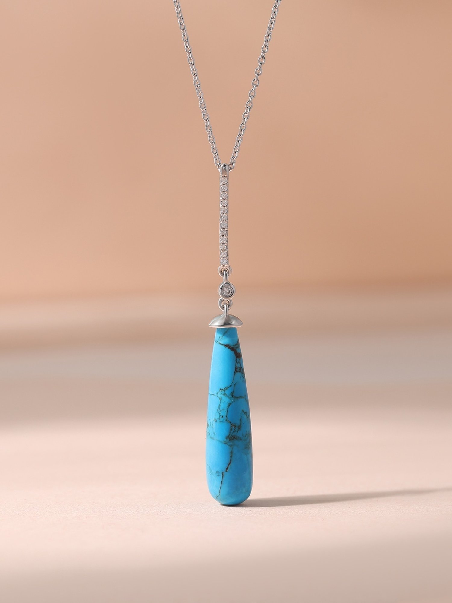 Ornate Jewels 925 Silver Rhodium Plated Drop Turquoise Pendant