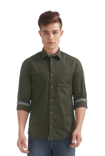 olive shirt blue jeans