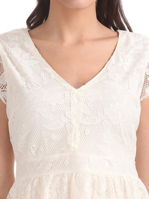 chinese dress ladies Aeropostale Women's Smocked Waist Short Sleeve Mini Dress, Ivory at Amazon  Women's Clothing store main image 1