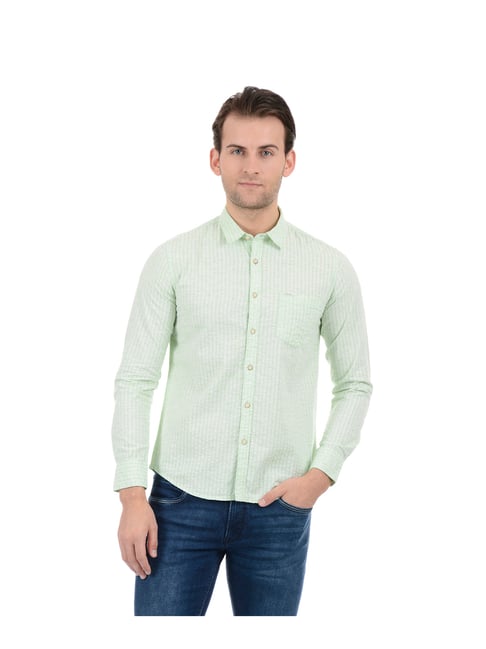 green shirt with light blue jeans