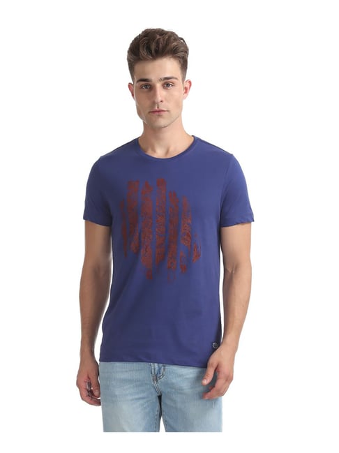 purple shirt and blue jeans