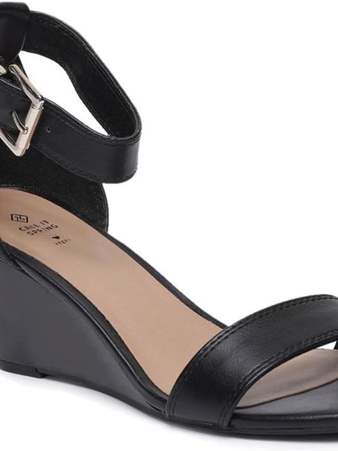 Call it spring 2025 black wedges