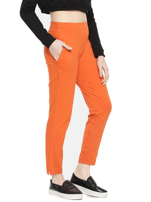 Buy Online Women Orange Abstract Print SideSlit Trousers at best price   Plussin