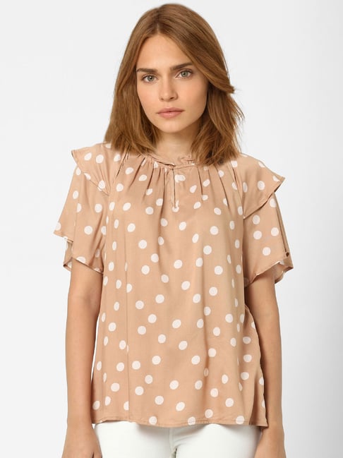 beige polka dot top