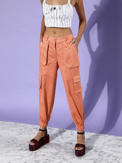 MILAN, ITALY - SEPTEMBER 23, 2022: Woman with orange cargo trousers and  white bra before Sportmax fashion show, Milan Fashion Week street style  Stock Photo - Alamy