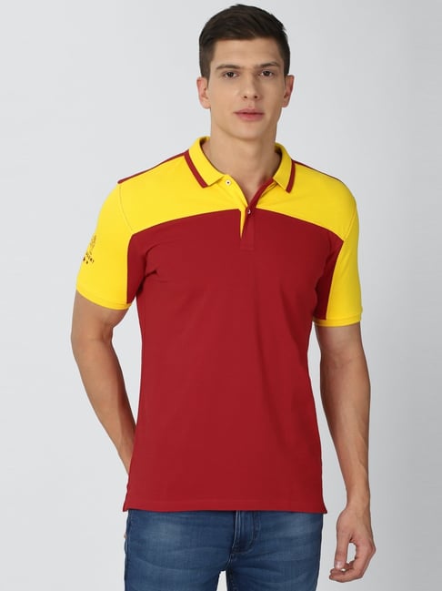 yellow shirt with red collar