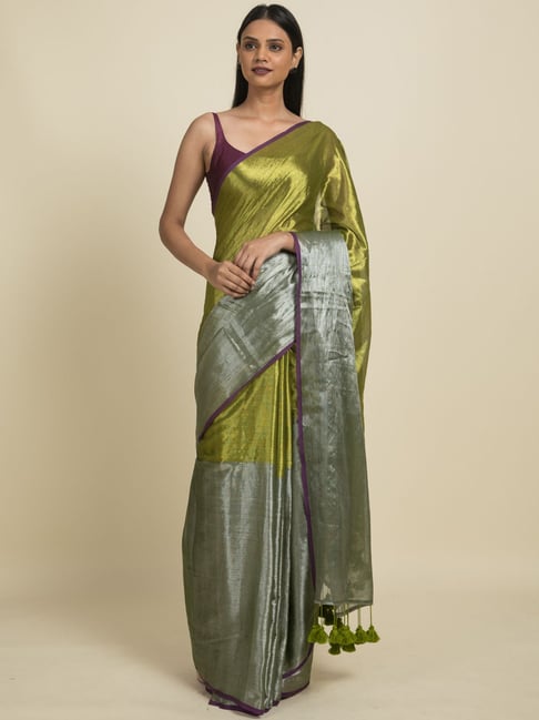 Yellow - Linen saree in pastel green with silver zari border and foil print  Blouse - Matching green blouse material with silver motifs. Price - 4250  INR Kindly write to us at