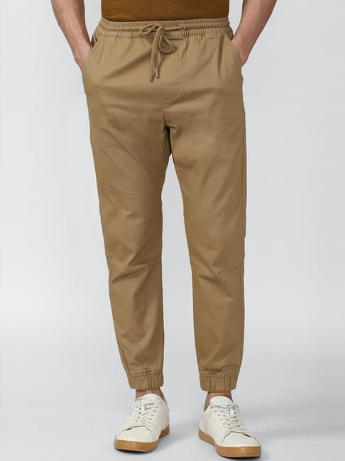 Peter England Casual Trousers  Buy Peter England Men Beige Solid Carrot Fit  Casual Trousers Online  Nykaa Fashion
