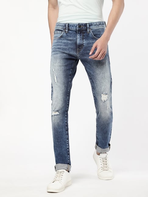 ASOS DESIGN skinny jeans in mid wash with heavy rips - ShopStyle
