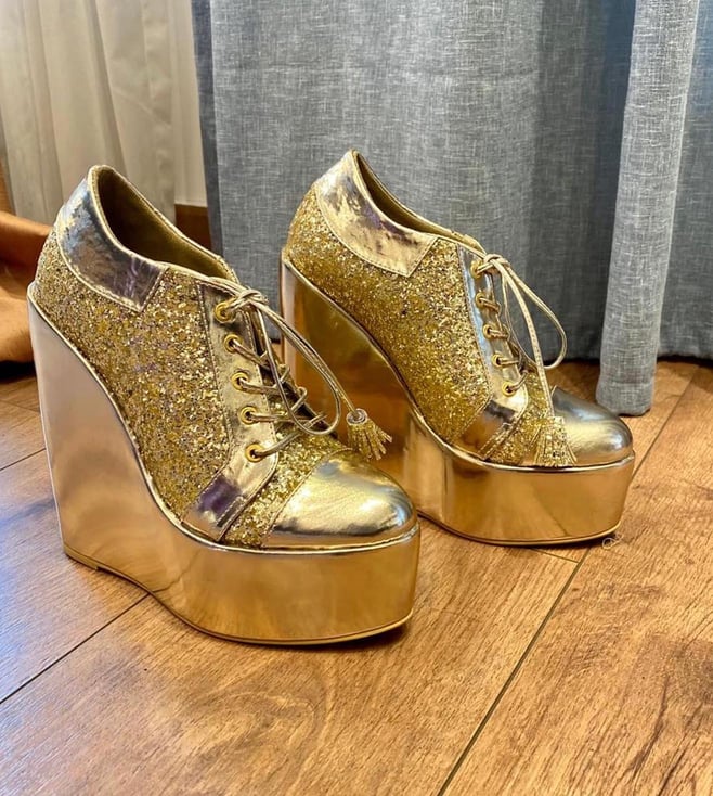 Gold high store top wedge sneakers