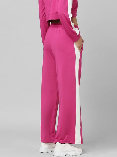 Casual Pants Of Pink Color. Pink Trousers On Wooden Background.  High-quality Merchandise In Stock. Girl's Pants On White Showcase. Stock  Photo, Picture and Royalty Free Image. Image 57175995.